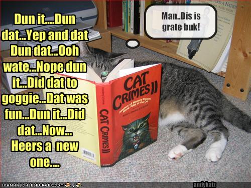 [funny-pictures-cat-reads-a-book-about-crimes.jpg]