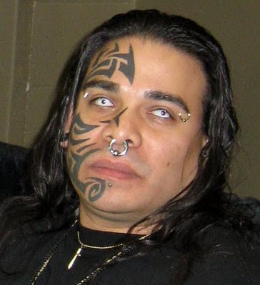 Tribal half face tattoo