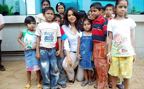 Actress Sameera Reddy hot and sexy unseen photoshoot in white shirt as the brand ambassador of Dreams Home NGO