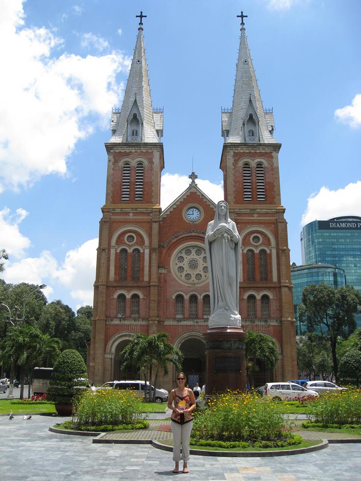 [01+-+Dena+holding+our+Golden+Bible+in+front+of+the+Cathedral+in+Saigon.JPG]