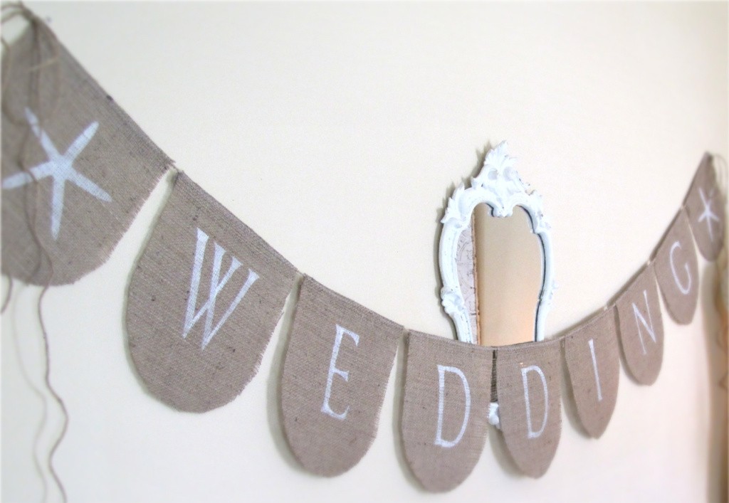 Perfect for an outdoor beach wedding This burlap banner has a pretty 