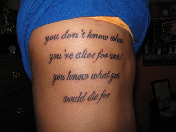 side tattoos. side tattoos of quotes. side
