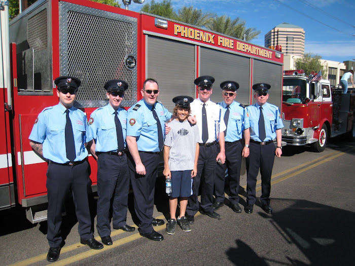this is me with fire fighters from Ireland at the Saint Patricks day parade in downtown Phoenix