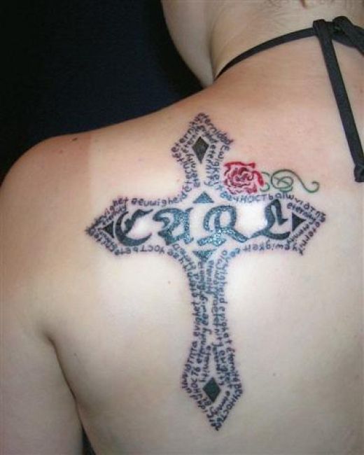 Love this cross tattoo on the shoulder deff a good tattoo idea for you 