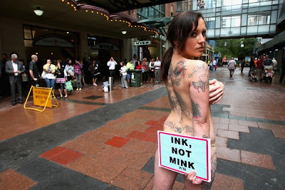 Tattooed Model Stands For PETA Protest