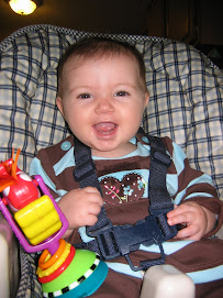 Smiling in Highchair