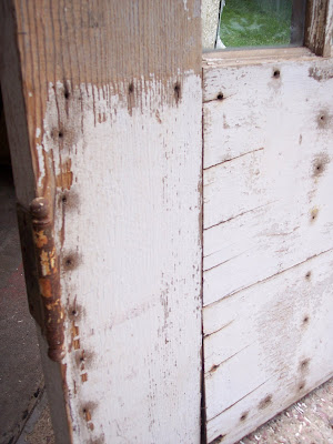 Old wooden door made into a head board