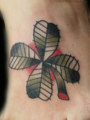 tattoo designs for girls feet. many girls like clover tattoo