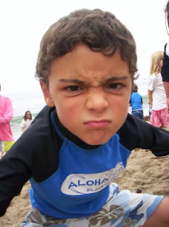 Aloha Beach Camp Keiki camper making a funny face on the beach