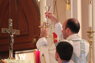 Elevation of the chalice.