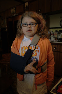 Kennedy with her sling on, still saying I Love You, even with her hand inside the sling...what a doll