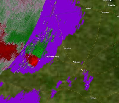 Velocity Data. Green shows winds moving towards the radar, red away. This image shows rotation(possible tornado) near Tennessee Colony.