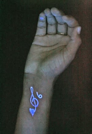 Black light tattoos, those that are visible only under ultraviolet light and Black light tattoos, those that are visible only under ultraviolet light and