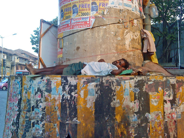 homeless man sleeping on street