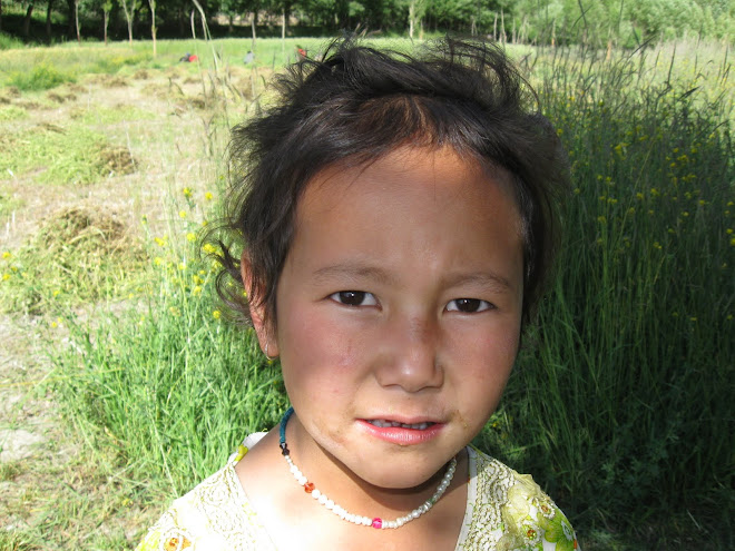 Children helping and playing in the fields.