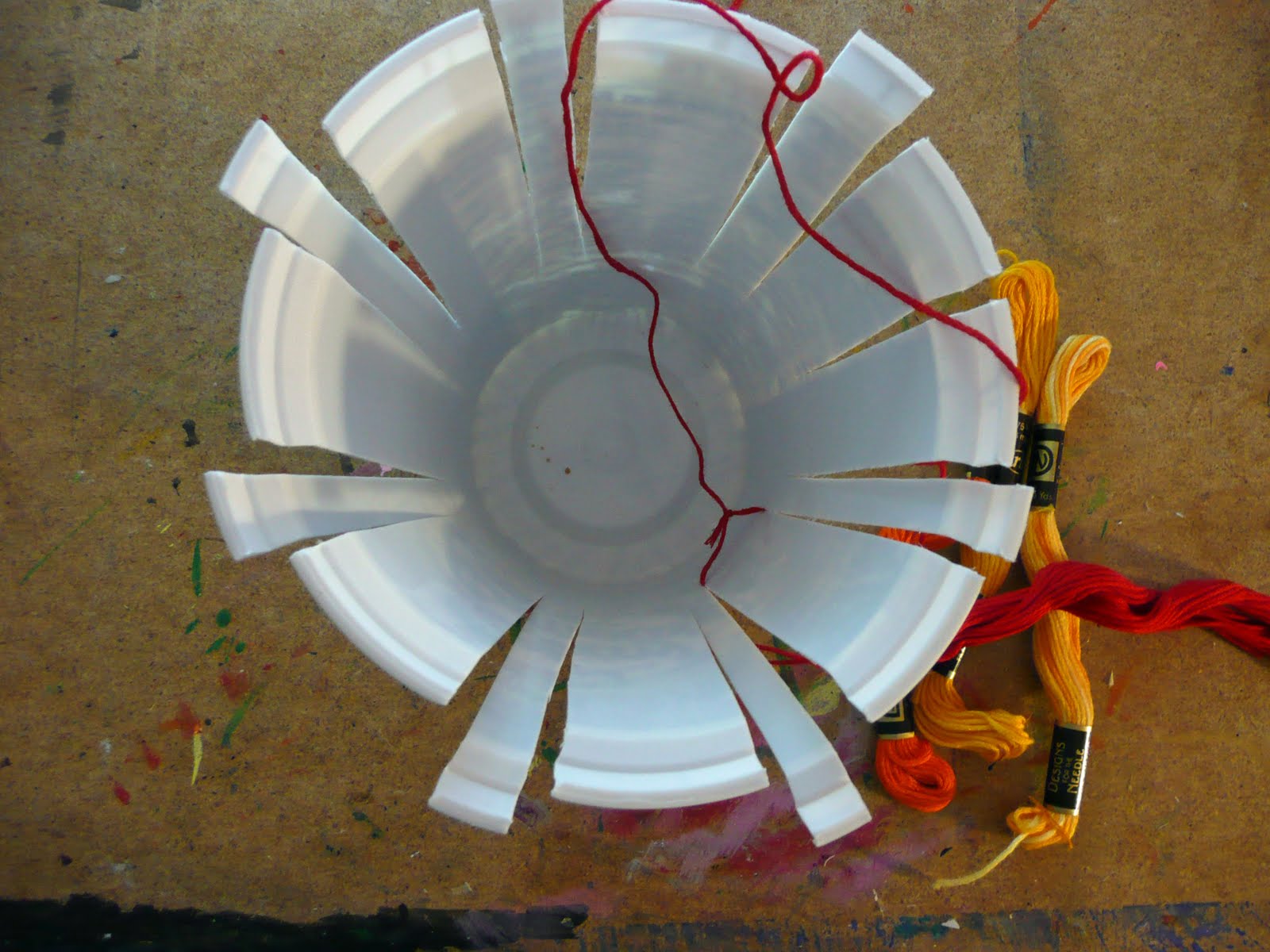 that artist woman Basket Weaving using Recycled Containers