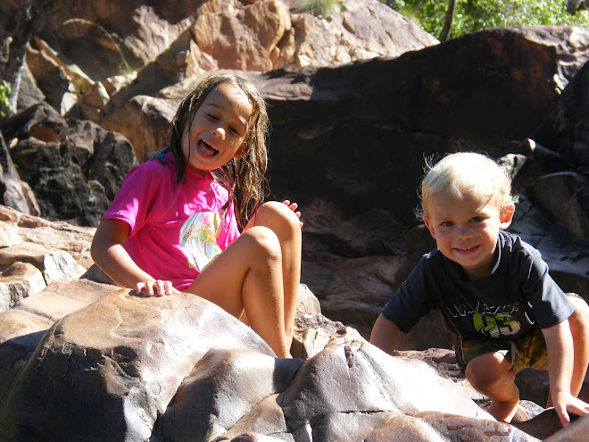 playing at the top of the falls