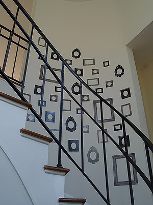  used here to creatively line the walls of the home's curved staircase.