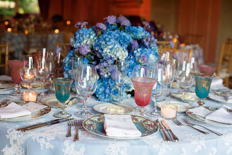 Table setting with lavender hydrangea centerpiece lace overlay tablecloth