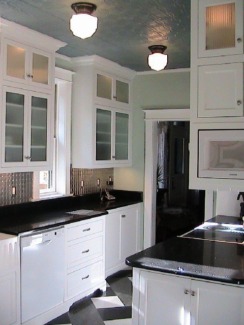 White Kitchen With Black Tile Countertops