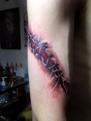 cross tattoos for men on shoulder blade. cross tattoos with wings