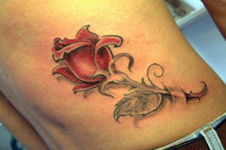 rose tattoo, lower back tattoo