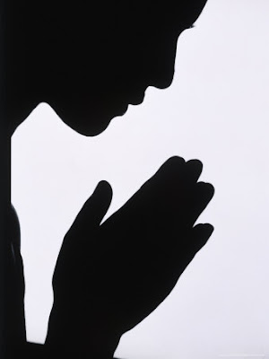 453091-FB~Silhouette-of-Woman-Praying-Posters.jpg