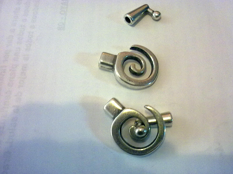cierre  espiral baño plata