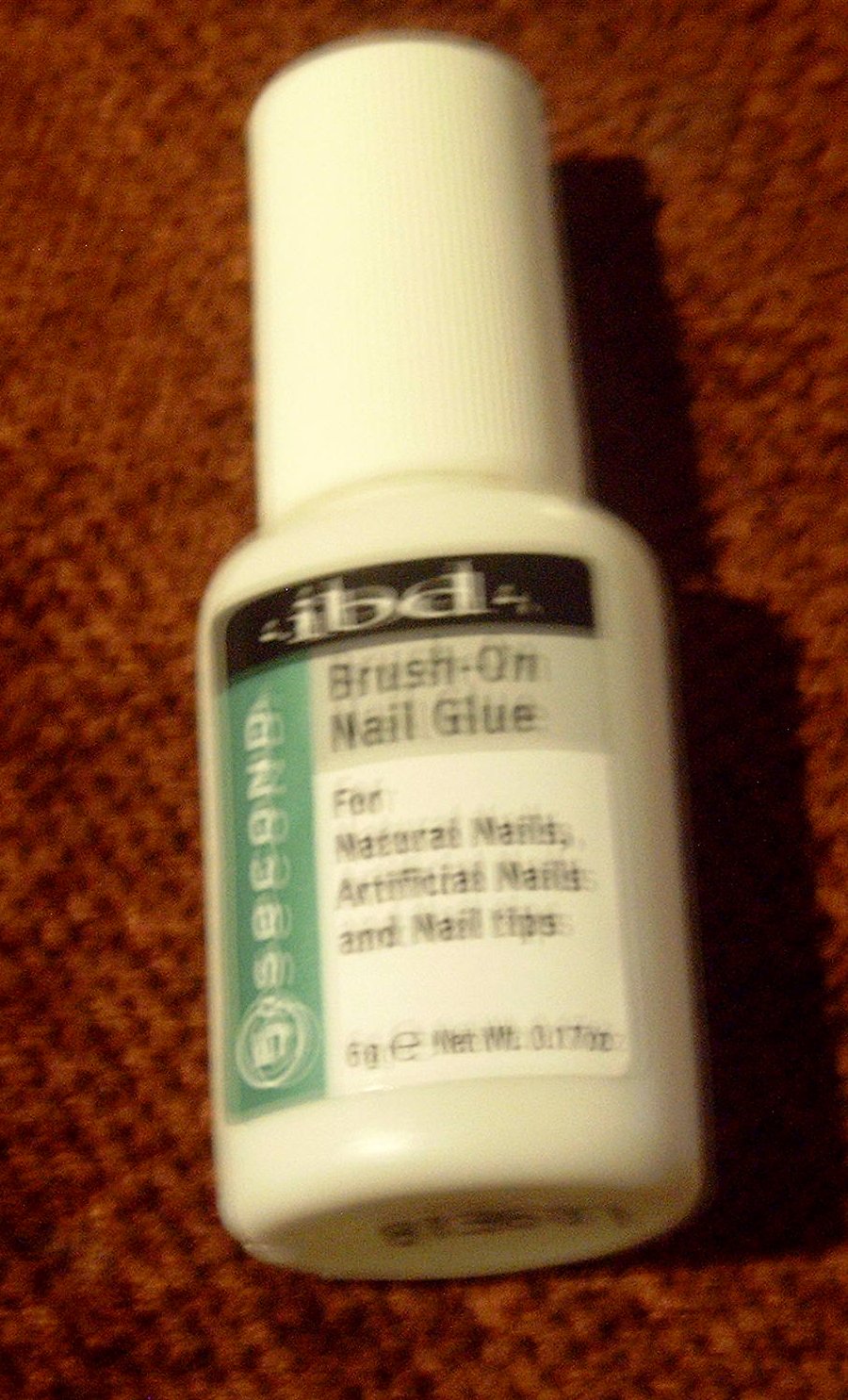 Nail glue, any 90 second brand works great. I like the IBD brush-on style