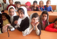 Afghan school children crowd into class during the first day of school at Jan Qadam Elementary School, Parwan Province, March 24. (U.S. Army photo by Staff Sgt. Marie Schult)