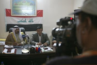 Sheikh Hamid Ahmed Al-Hashim, city council chairman, and Sa'ad Awad Rashad Al-Dulaimi, city mayor, conduct a question and answer session with local Arab media after the State of the City Address for the Fallujah, Aug. 8, 2008. Hamid delivered his speech to Fallujah citizens addressing the progress the city has made this year, focusing on the quality of life projects and security improvements.