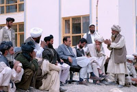 An elder with the Kuchi tribe explains his situation to Ali Khashe, deputy governor of Afghanistan’s Wardak province. The Kuchi have asked for water and veterinarian supplies for their livestock as a condition to stop fighting with the Hazara tribe.