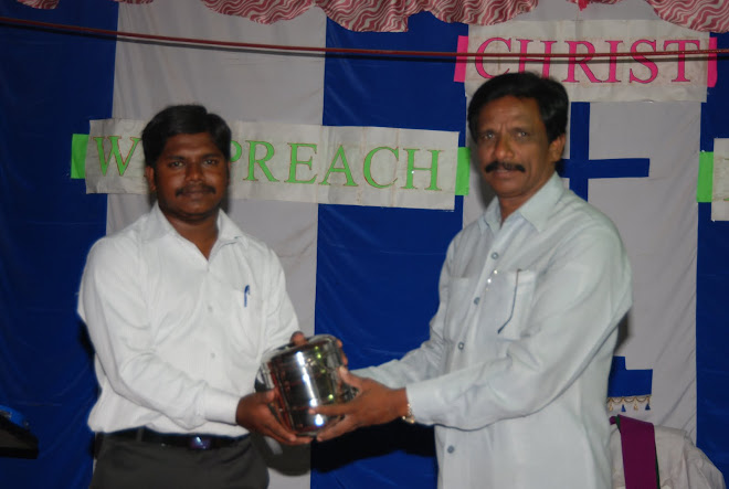 Pastor Manohar receiving award from Bro Gona Philip