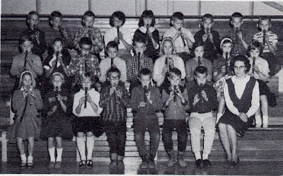 The fourth grade of St John Elementary School in Seward, Nebraska, playing recorders. The image was scanned from the 1965-1966 yearbook.
