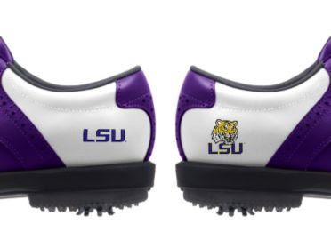 LSU golf shoes with purple trim on white base with two different logos of Tiger mascot and writing of LSU in purple above black rubber cleats.