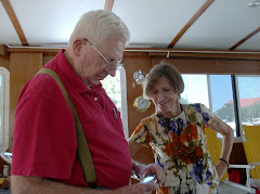 Fred and Paula inspect the new camera.  It's NOT a lightweight. Small and amazing!