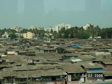shanties and Mumbai skyline