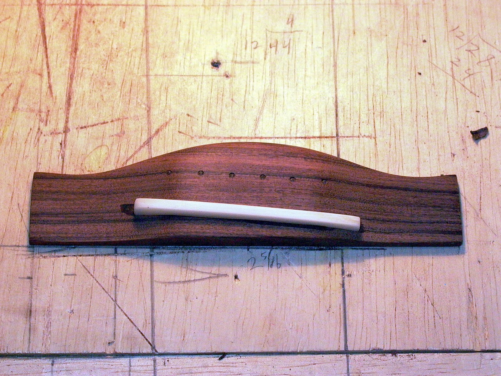 ThreeQuartersLeft Acoustic guitar bridge and saddle and bridge positioning