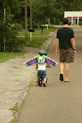 Buzz on a bike, and his daddy