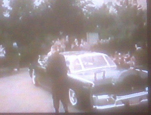 agents near car, bubbletop, England, April 1963