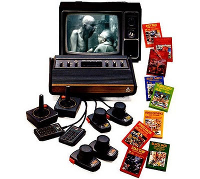 Image of an old Atari VCS with an old TV, with the inset picture taken from Aphex Twin's Come To Daddy, of an old lady bracing herself from the onslaught of a shouting alien.
