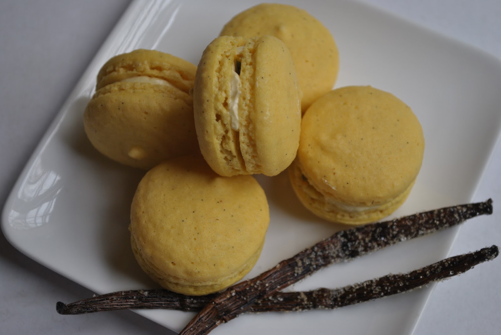 The Kitchen Guardian Vanilla Bean Macarons with Passion Fruit Buttercream Filling