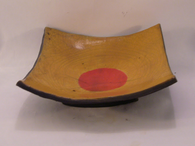 Yellow plate with red sun -- raku
