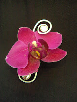 Orchids make a stunning statement on any wrist or tuxedo lapel!