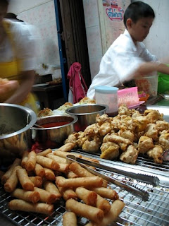 Vegetarian things for sale - spring rolls and fried tofu