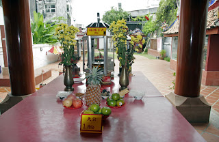 Lamps and offerings at the Shrine of the Serene Light