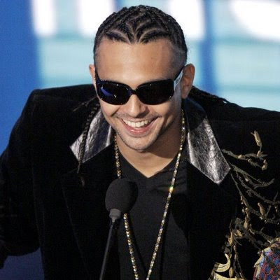 and distinctive cornrow hairstyle grabbed all the attention as he walked
