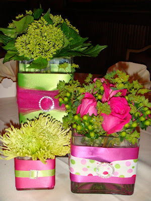 Table groupings composed of assorted square vases wrapped in ribbons of