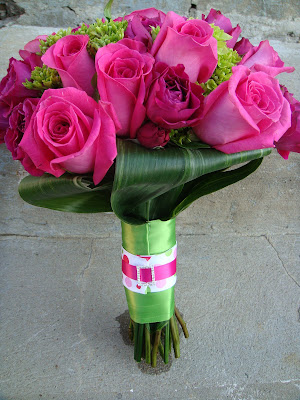 Bouquet of Ravel roses, hot pink spray roses, & green hydrangea.