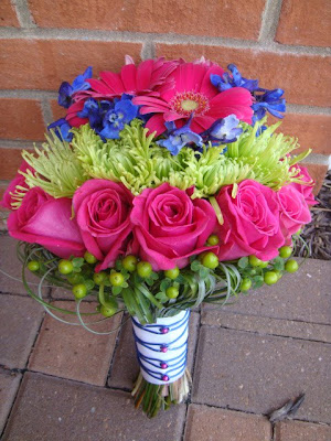 Bridal bouquet designed in layered fashion Hot pink gerber daisies 
